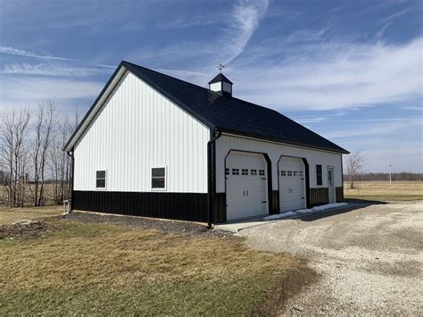 white and black pole barn